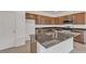 Well-equipped kitchen featuring granite countertops, stainless steel appliances, and ample cabinet space at 7482 Lodano Ave, Las Vegas, NV 89113