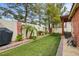 Lush backyard with artificial turf and custom block wall at 7608 Vista Hills Dr, Las Vegas, NV 89128