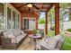 Backyard covered patio features comfortable seating and a ceiling fan at 7608 Vista Hills Dr, Las Vegas, NV 89128