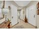 Inviting tiled foyer with decorative lighting and neutral decor at 7608 Vista Hills Dr, Las Vegas, NV 89128