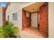 Inviting front entrance with tiled accents and a decorative security door at 7608 Vista Hills Dr, Las Vegas, NV 89128