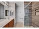 Bathroom with double sinks and glass shower at 7732 Songster St, North Las Vegas, NV 89084