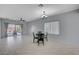 Bright dining area featuring a modern chandelier and an open layout, perfect for entertaining at 7732 Songster St, North Las Vegas, NV 89084