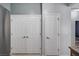 Hallway view of closet doors at 7732 Songster St, North Las Vegas, NV 89084