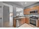 Open kitchen with granite countertops and modern stainless steel appliances at 7732 Songster St, North Las Vegas, NV 89084