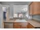 Kitchen with a view into the dining and living room at 7732 Songster St, North Las Vegas, NV 89084