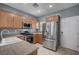 Bright kitchen with stainless steel appliances, granite counters, and ample cabinet storage at 7732 Songster St, North Las Vegas, NV 89084