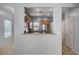 Open kitchen featuring granite counters, stainless steel appliances, and modern lighting at 7732 Songster St, North Las Vegas, NV 89084