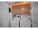 Functional laundry room featuring washer, dryer and shelving at 7732 Songster St, North Las Vegas, NV 89084