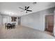 Open-concept living room with tile flooring and dining area at 7732 Songster St, North Las Vegas, NV 89084