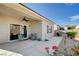 Relax on the patio with views of the landscaped backyard under a clear blue sky at 7732 Songster St, North Las Vegas, NV 89084