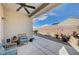 Relaxing covered patio with seating area and views of the landscaped backyard at 7732 Songster St, North Las Vegas, NV 89084