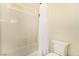 Bathroom showing bathtub and shower featuring a small window and white tiling at 7900 Riviera Beach Dr, Las Vegas, NV 89128