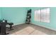 Bright bedroom with piano, shelving, and a large window, featuring light-blue walls and gray carpet at 7900 Riviera Beach Dr, Las Vegas, NV 89128