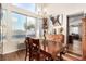 Inviting dining area with natural light, wooden furniture, and elegant decor at 7900 Riviera Beach Dr, Las Vegas, NV 89128