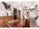Elegant dining area with wooden furniture, stylish decor, and access to other living spaces at 7900 Riviera Beach Dr, Las Vegas, NV 89128