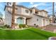 Charming two-story home with manicured lawn, mature trees, and a well-maintained landscape at 7900 Riviera Beach Dr, Las Vegas, NV 89128