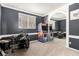 Entertaining game room with dark gray walls, an arcade game and a drum set reflected in the mirror at 7900 Riviera Beach Dr, Las Vegas, NV 89128