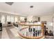 Open loft area with abundant natural light, views of the floor below, and cozy seating at 7900 Riviera Beach Dr, Las Vegas, NV 89128