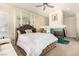 Bright main bedroom with a unique fireplace feature, cozy seating, and large mirrors at 7900 Riviera Beach Dr, Las Vegas, NV 89128