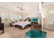 Tranquil primary bedroom showcases a unique fireplace and soft natural light through many windows at 7900 Riviera Beach Dr, Las Vegas, NV 89128