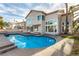 Beautiful pool with tiled trim and a spacious patio, perfect for entertaining or enjoying the outdoors at 7900 Riviera Beach Dr, Las Vegas, NV 89128