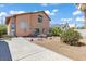 Spacious backyard featuring a patio area, desert landscaping, and block wall at 7954 Kentshire Dr, Las Vegas, NV 89117