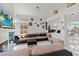 Spacious living room with fireplace, entertainment center, and lots of seating at 7954 Kentshire Dr, Las Vegas, NV 89117