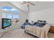 Spacious main bedroom featuring a ceiling fan, large window and comfortable furnishings at 7954 Kentshire Dr, Las Vegas, NV 89117