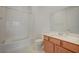 Clean bathroom with a shower-tub combo and a wooden vanity at 80 Brixton Ave, Henderson, NV 89011