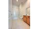 Bright bathroom with a shower and tub combination, and a wood vanity that offers ample storage space at 80 Brixton Ave, Henderson, NV 89011