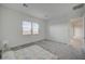 Airy bedroom featuring plush carpeting and two windows at 80 Brixton Ave, Henderson, NV 89011