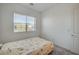 Cozy bedroom featuring a comfortable bed and natural light from the window at 80 Brixton Ave, Henderson, NV 89011
