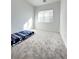Inviting bedroom featuring plush carpet, a sunny window, and ample space for relaxation at 80 Brixton Ave, Henderson, NV 89011
