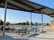 Relaxing community pool area with ample seating, picnic tables, and nearby shade, perfect for summer gatherings at 80 Brixton Ave, Henderson, NV 89011