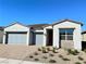 Attractive single-story home featuring desert landscaping and a three-car garage at 80 Brixton Ave, Henderson, NV 89011
