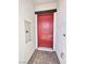 Stylish red front door with modern hardware at 80 Brixton Ave, Henderson, NV 89011