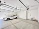 Spacious three-car garage with modern lighting and concrete floor at 80 Brixton Ave, Henderson, NV 89011