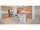 Bright kitchen features granite counters, stainless steel appliances, and an island with breakfast bar at 80 Brixton Ave, Henderson, NV 89011