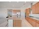 Modern kitchen featuring stainless steel appliances, granite counters, and a kitchen island at 80 Brixton Ave, Henderson, NV 89011