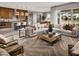 Beautifully staged open-concept living room with stylish furniture and adjacent kitchen at 80 Brixton Ave, Henderson, NV 89011