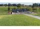 Park workout area with fitness equipment set among lush green grass and landscaping at 80 Brixton Ave, Henderson, NV 89011