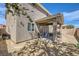 Exterior showing covered patio and gravel backyard, home exterior at 8084 Celina Hills St, Las Vegas, NV 89131