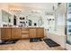 A beautifully appointed bathroom with double sinks, stylish decor, and modern lighting at 8084 Celina Hills St, Las Vegas, NV 89131