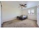 This secondary bedroom boasts a ceiling fan, neutral paint, and plush carpeting at 8084 Celina Hills St, Las Vegas, NV 89131