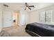 Bedroom showcasing carpet, window, closet doors, and ceiling fan at 8084 Celina Hills St, Las Vegas, NV 89131