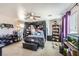 Spacious primary bedroom with dark furniture, plush carpet, and a ceiling fan at 8084 Celina Hills St, Las Vegas, NV 89131