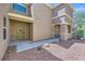 Close-up of the front entrance, highlighting the covered porch, security door, and low-maintenance desert landscaping at 8084 Celina Hills St, Las Vegas, NV 89131