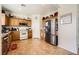 Well-maintained kitchen with wooden cabinetry, stainless steel appliances, and ample counter space for meal preparation at 8084 Celina Hills St, Las Vegas, NV 89131