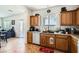 Functional kitchen featuring wooden cabinets, modern appliances, and an open layout connecting to the living area at 8084 Celina Hills St, Las Vegas, NV 89131